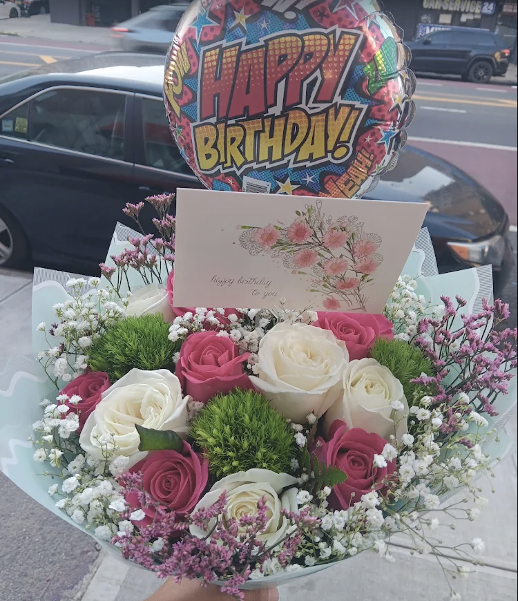 Pink and white rose bouquet with a Happy Birthday balloon and card