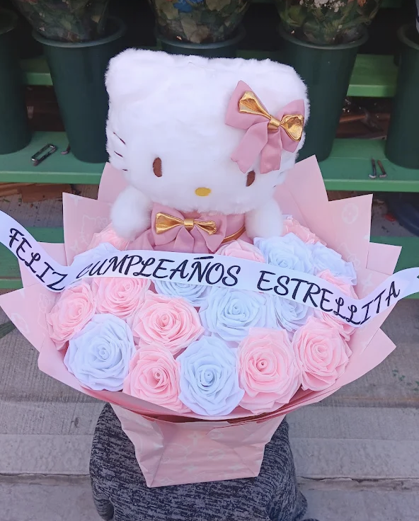 Pink and blue roses with a Hello Kitty plush and personalized sash