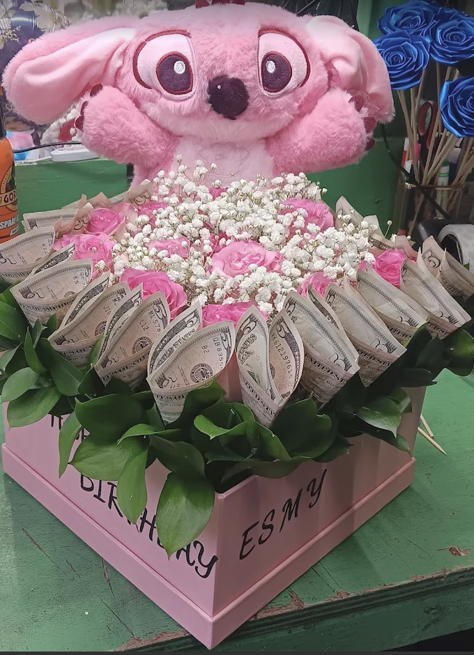 Pink birthday box with roses, greenery, money and a pink plush