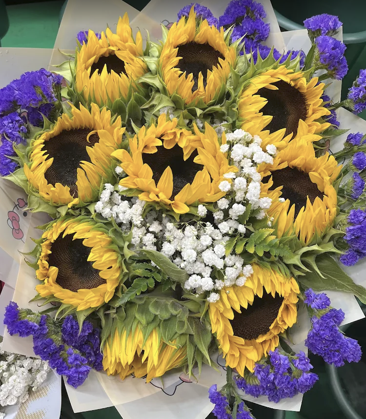 Sunflower bouquet with purple statice and baby's breath